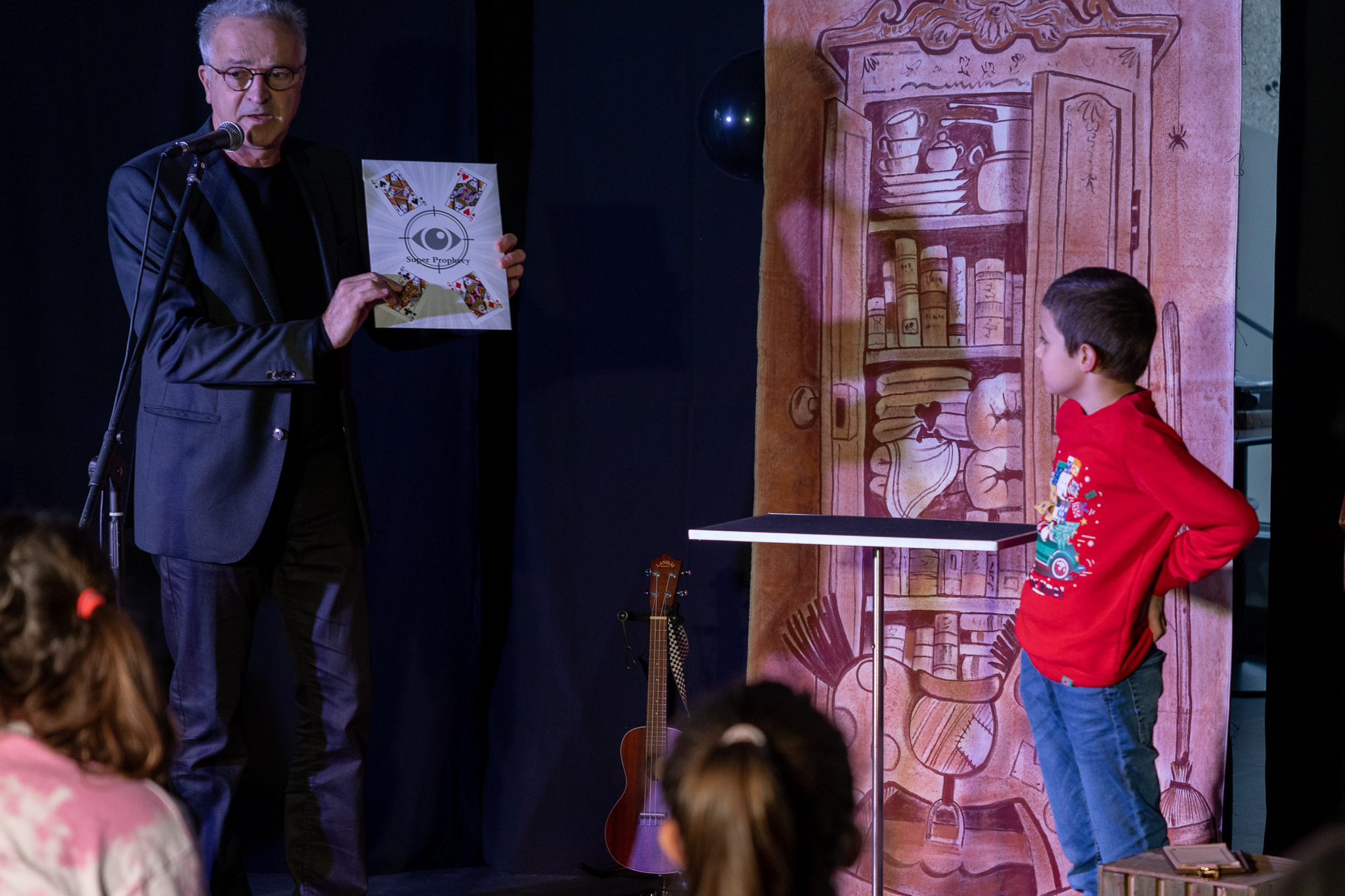 man with quiff and brown tinted sunglasses wearing a fur collar