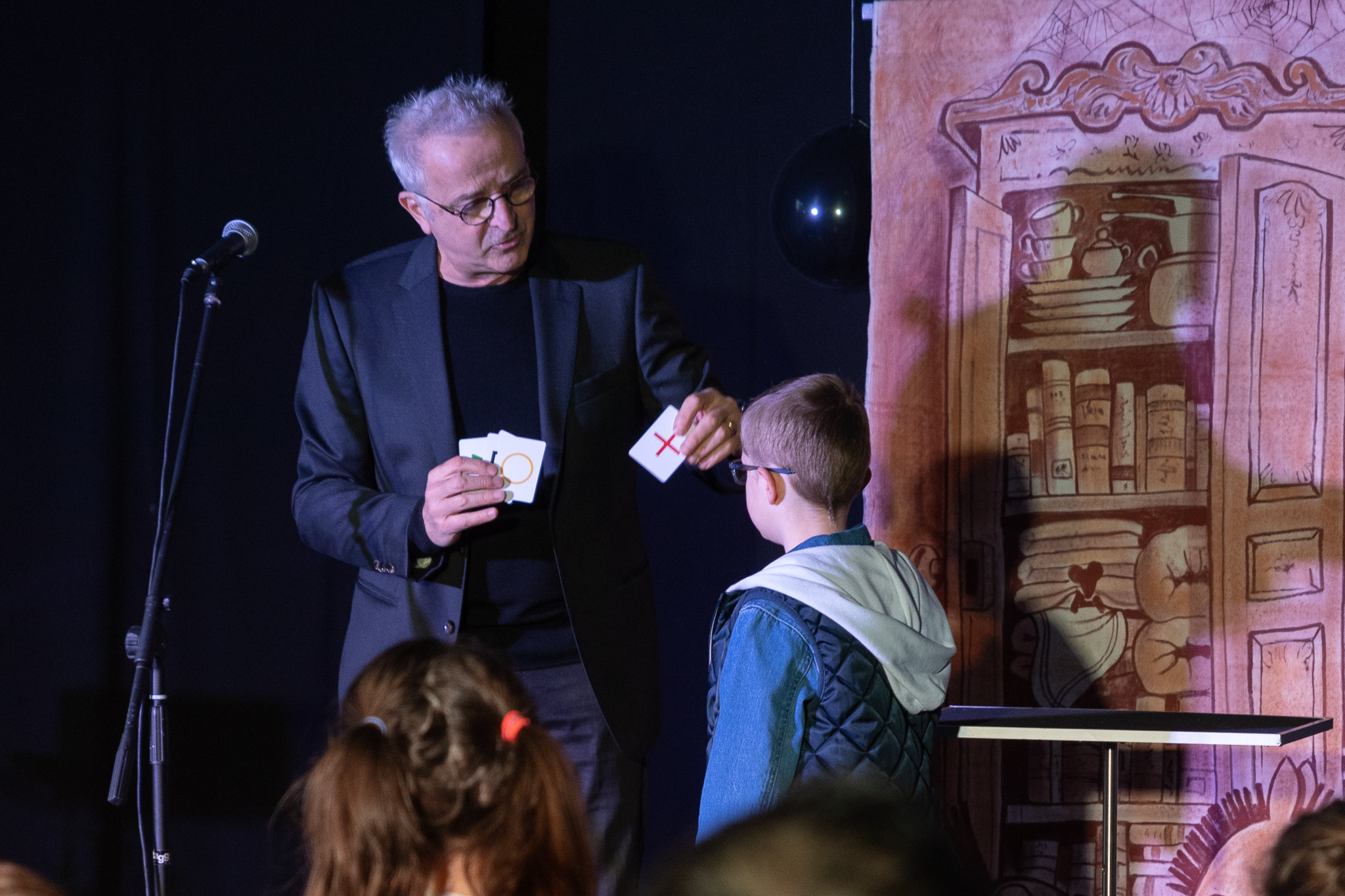 young boy sitting in barbers chair